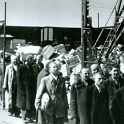 Auschwitz 1944 probably late May - June.Nazis asses built extra train tracks which pulled up close to the gas chambers.It allowed them to gas over 10,000 per day.<br />The Nazis had more than one gas chamber with crematorium in Auschwitz-Birkenau.Millions of Jews & Non-Jews went up the chimney in Auschwitz.<br />These look to be Jewish Men selected to live.Atleast for now.