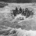 another shot of the dangerous job of bringing logs from the mountains